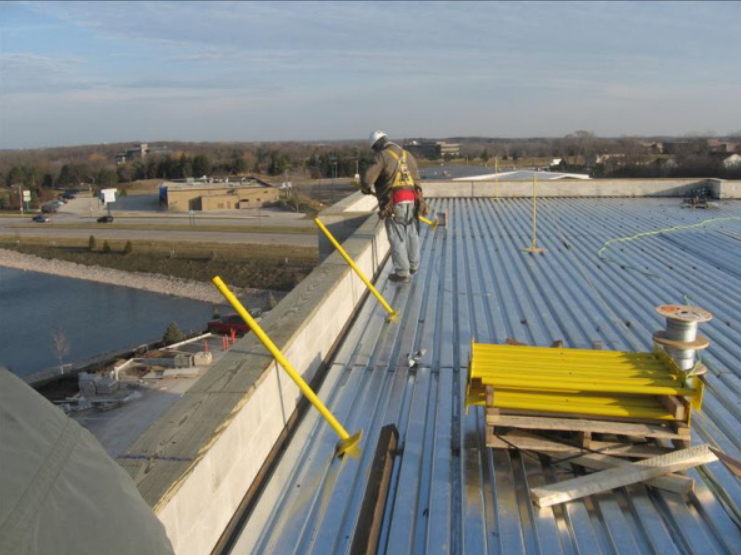 Sheet metal roof being installed by Champion Roofing contractors on a commercial building in Chicago.