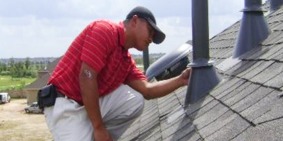 man-completing-certified-roof-inspection