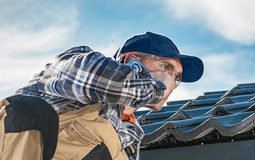 Roofer taking a call.