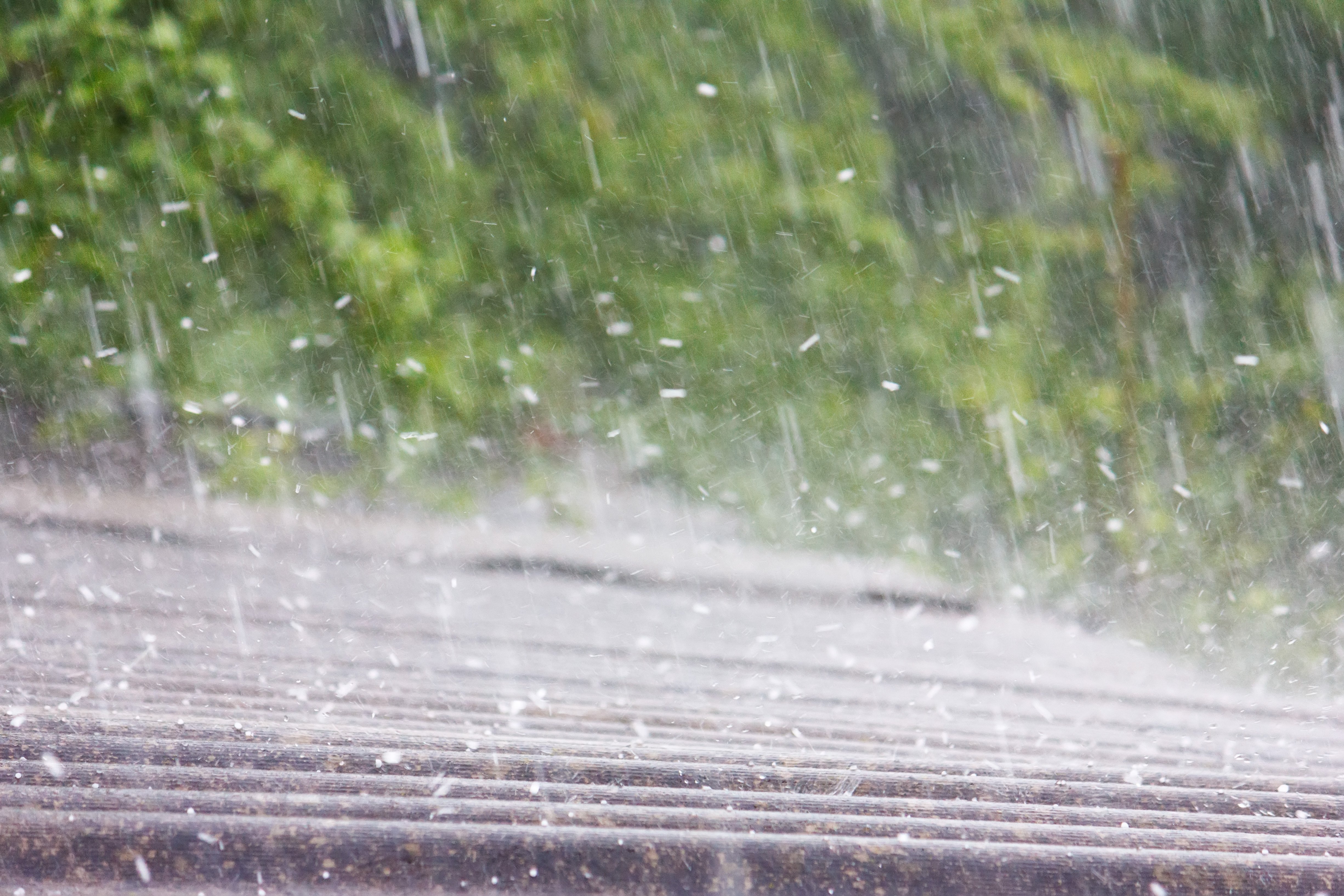 Hail falling onto a slate roof.